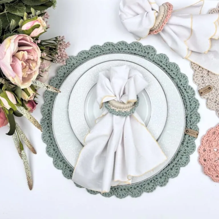Free crochet placemat and napkin holder pattern styled with white china and a folded linen napkin