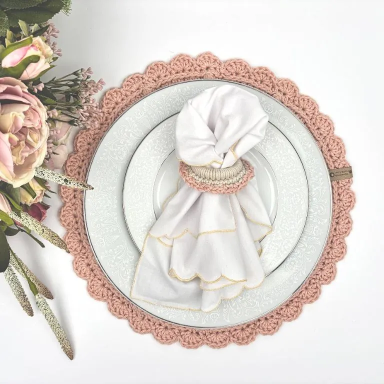 Plate on a round crochet placemat with a napkin in a crochet napkin holder from the free Madison Table Set pattern