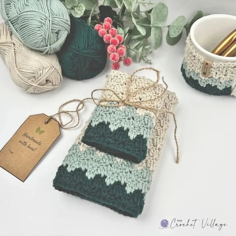 Crochet washcloth and towel set in green and cream, tied with twine as a handmade Christmas gift